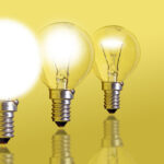An image of three incandescent light bulb at different stage of lighting up - idea and thought process concept