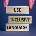 Use inclusive language symbol. Wooden blocks with words 'Use inclusive language'.