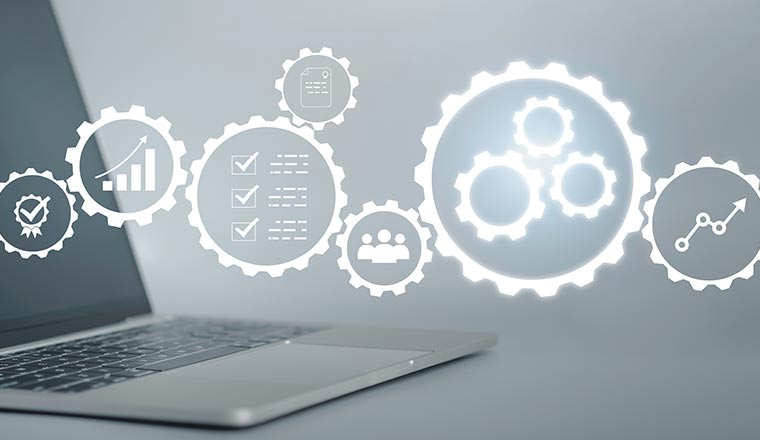 Optimisation concept with laptop behind process improvement icons