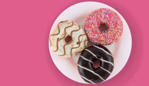 Difference of three - with colorful donuts on a white plate