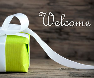 Green Gift with the Word Welcome - welcome gift concept