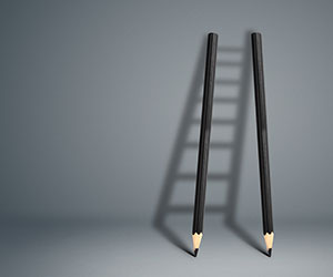 Two pencils making a ladder shadow - success concept