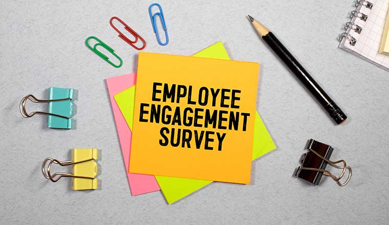Employee Engagement Survey sign written on sticky note