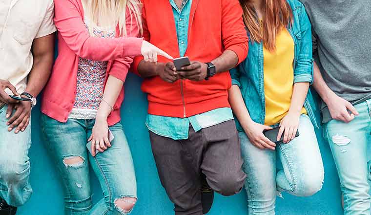 Group of people looking at phone