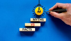 Facts vs myths symbol. Concept words Facts vs myths on wooden blocks on a beautiful blue table blue background