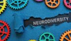 The inscription neurodiversity under the torn paper and colorful gear wheels.