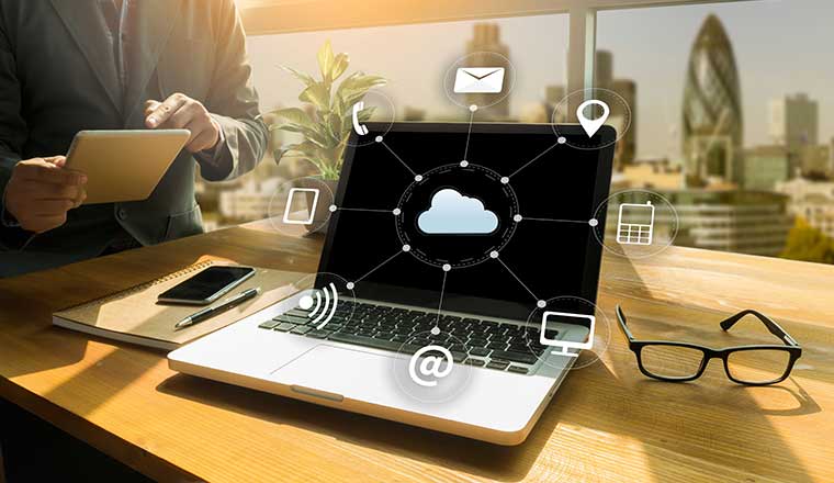 Cloud computing concept with laptop, cloud icon and contact icons around it