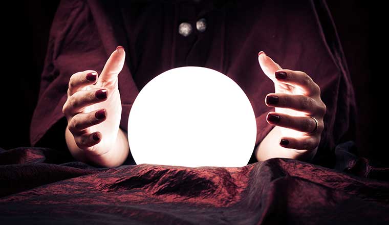 Future concept with fortune teller hands and crystal ball