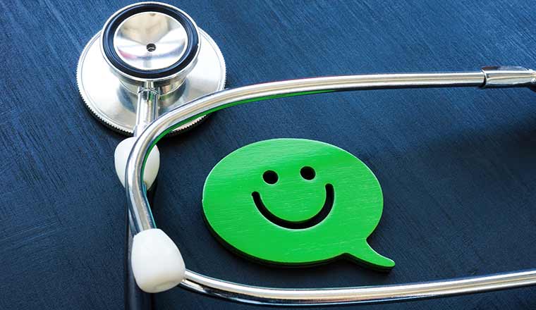 Positive patient experience concept. Stethoscope and smiley face.