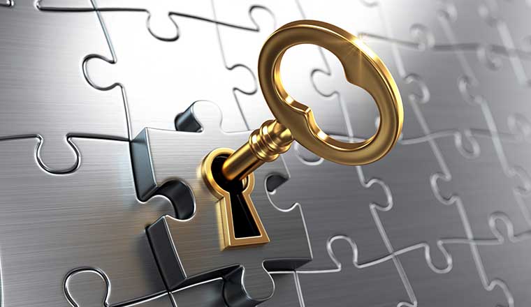 Golden key and puzzle - unlock concept