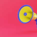 Announcement concept with megaphone on pink background
