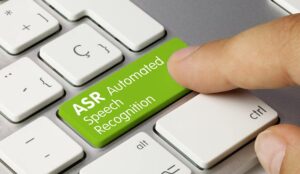 ASR automated speech recognition Written on Green Key of Metallic Keyboard.