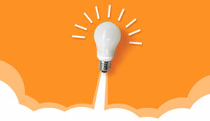 Light bulb launching like a rocket on orange background