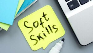 Soft skills concept. With soft skills written on Memo with a laptop.