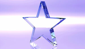 Star glass trophy on purple background - award