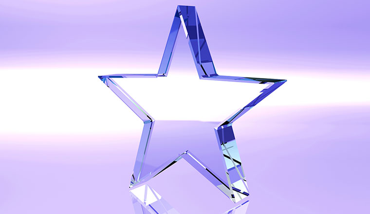Star glass trophy on purple background - award