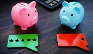 Piggy banks with ratings on the desk.