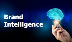 Brand Intelligence next to hand holding lightbulb with AI brain