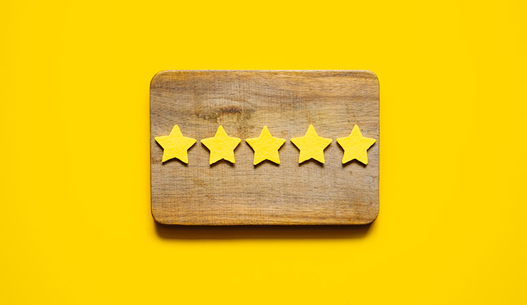 Customer Experience, Review Concept. Five yellow stars excellent rating in frame