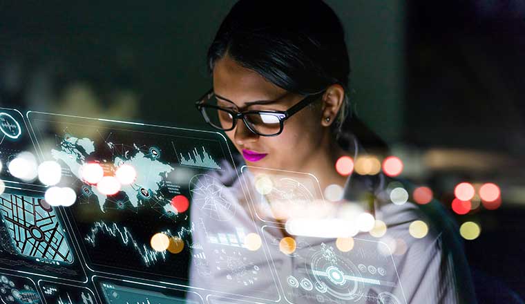 Person looking at holographic screen displaying data