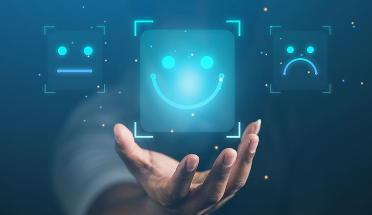 Person holding digital smiley face - positive experience concept