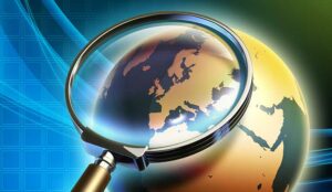 The Earth analyzed under a magnifying glass - global insights concept