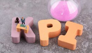Miniature world and hourglass on KPI letters