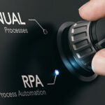 Hand turning a knob selecting RPA (Robotic Process Automation) mode