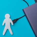 The charge of a person. Replenishment of energy. Powerbank charges a person with a USB cable