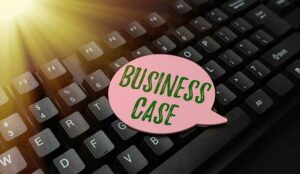 Technology business case concept with speech bubble saying business case resting on keyboard