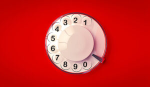 Rotary dialer with red background - dialling concept