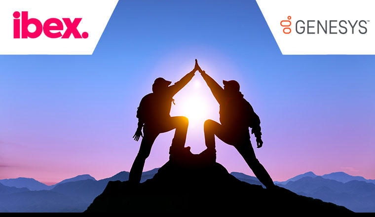 Two people standing at top of mountain giving high five - partnership concept