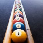 Colored billiard balls arranged in numerical order - metrics concept