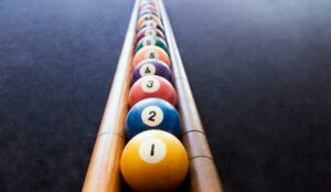 Colored billiard balls arranged in numerical order - metrics concept