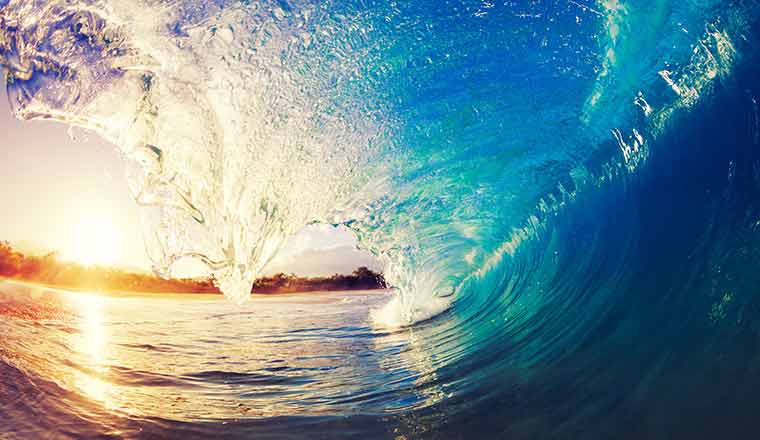 A wave rolling over in the ocean