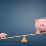 Financial comparison and the concept of balancing budgets with piggy banks on scale