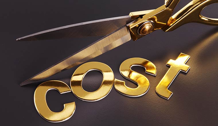 Cost cutting concept with the word cost next to scissors