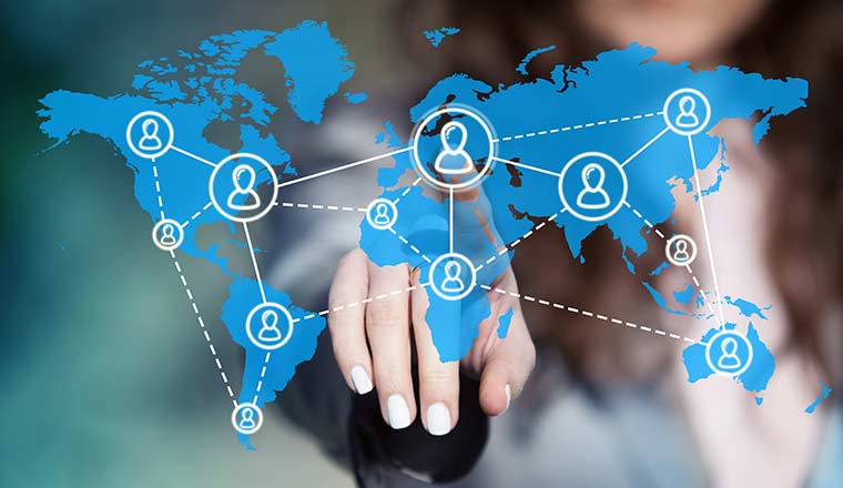 Global workforce and outsourcing concept with person touching world map with connected people icons