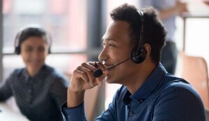 Happy call centre agent at desk