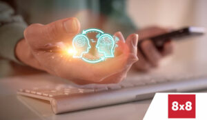 AI in customer service concept with hand 'holding' ai head silhouettes and mobile phone