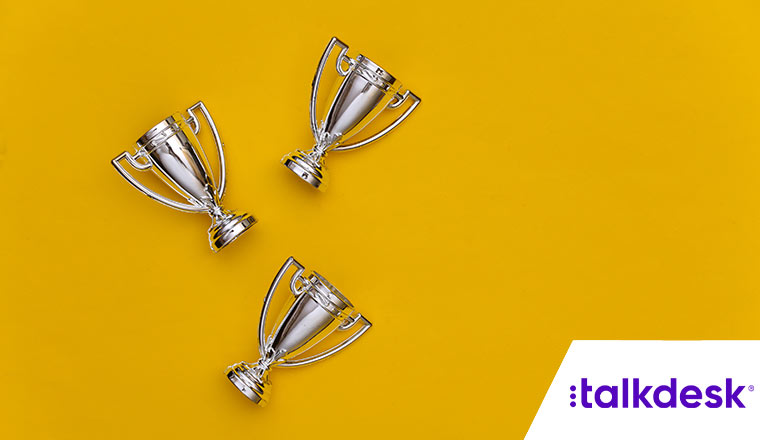 Three trophies on yellow background