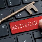 A key and finger on keyboard with word MOTIVATION