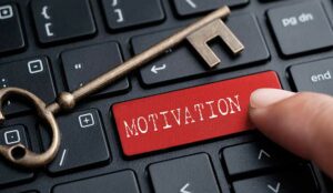 A key and finger on keyboard with word MOTIVATION
