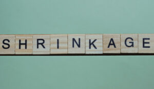 The word shrinkage made of small gray wooden letters