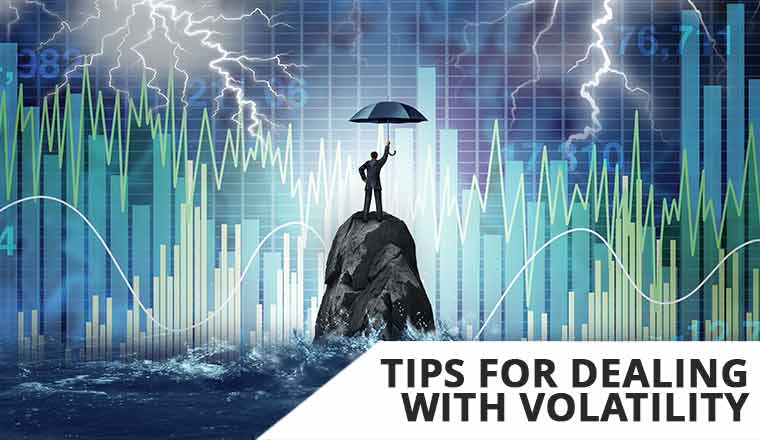 Volatility management concept with person with umbrella in front of charts with lightening