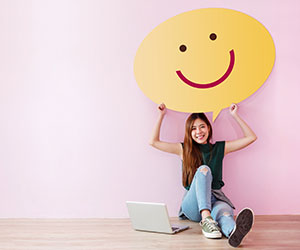 Person with smiley face on speech bubble