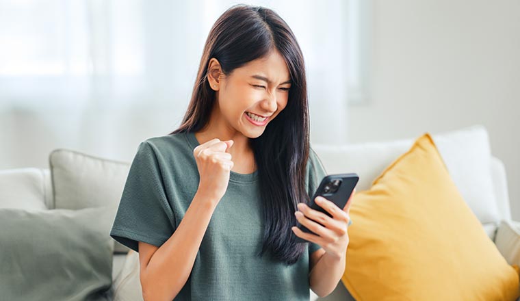 Happy person holding phone