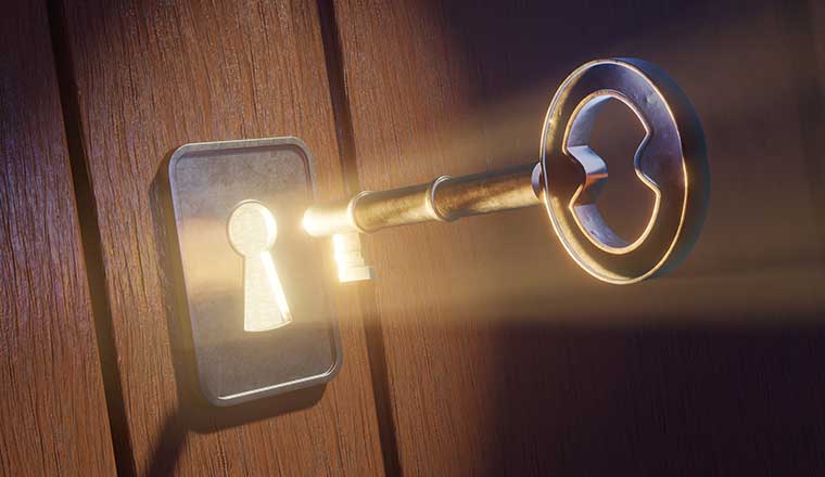 Unlocking loyalty concept with key being put into glowing keyhole