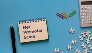 A notebook with the word Net Promoter Score.