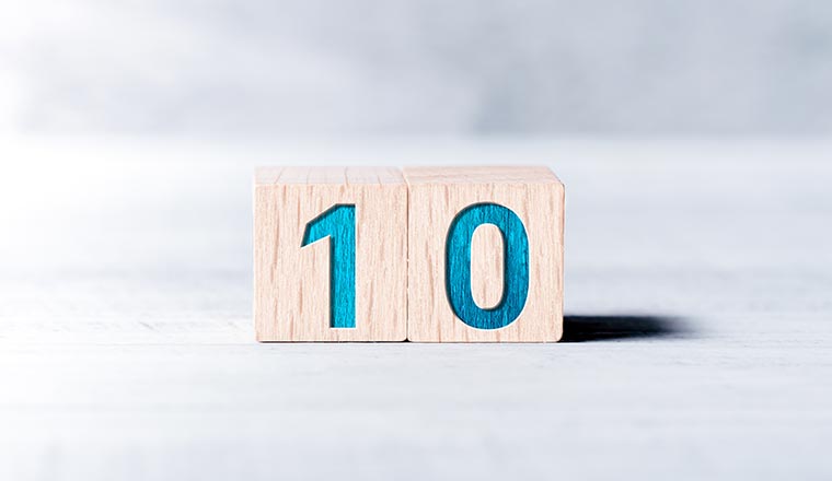 Number 10 Formed By Wooden Blocks On A White Table
